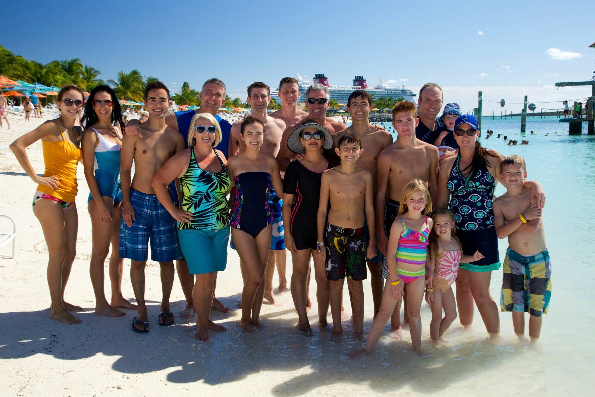 Daughtrey and Moore families together on a 4Life incentive cruise — Castaway Cay beach, Disney cruise ship in the background